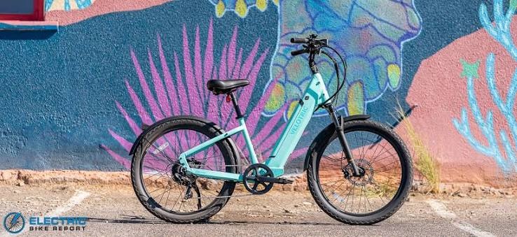 Modern step-through electric bike in a vibrant blue finish, combining stylish design with practical everyday commuting features.