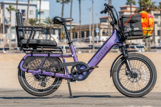 Purple Aventon electric cargo bike with rear passenger seat and front cargo basket.