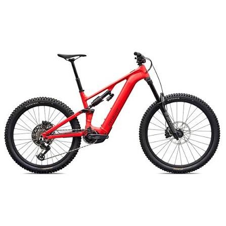 Red full-suspension electric mountain bike with mid-drive motor and knobby tires
