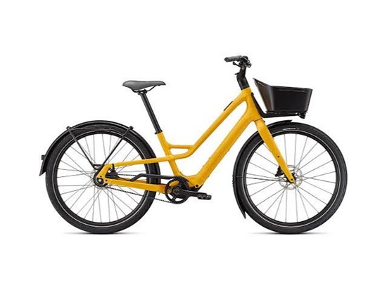 Mustard yellow step-through electric bike with a black front cargo basket.