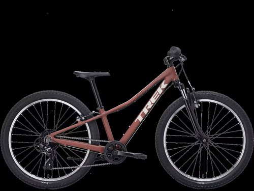Matte dusty-rose Trek youth mountain bike with front suspension and knobby tires.